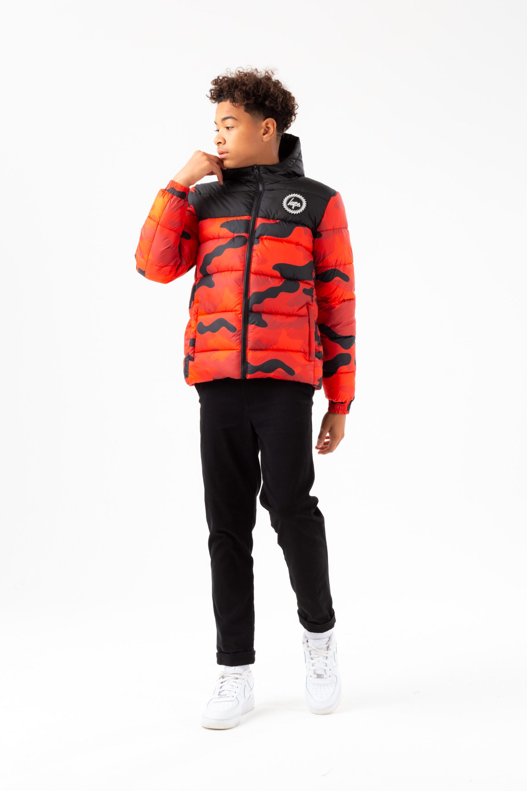 hype boys orange and black camo puffer jacket on model