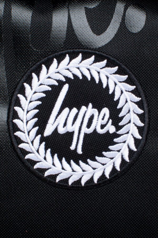 hype black backpack with multiple logos close up