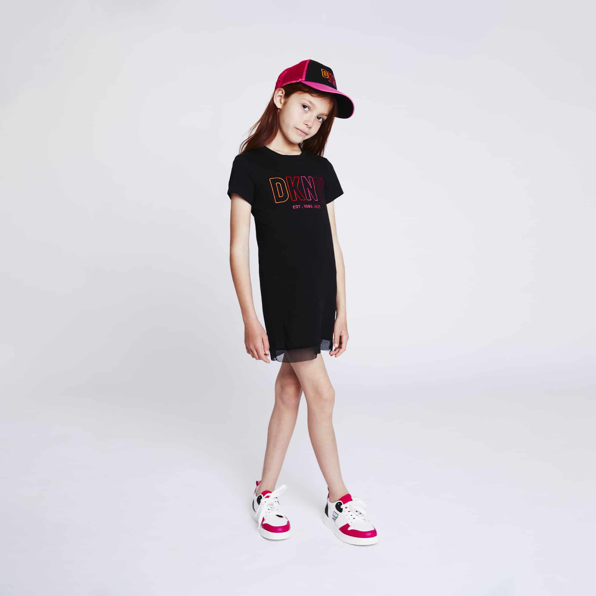 DKNY girls model in black dress and baseball cap