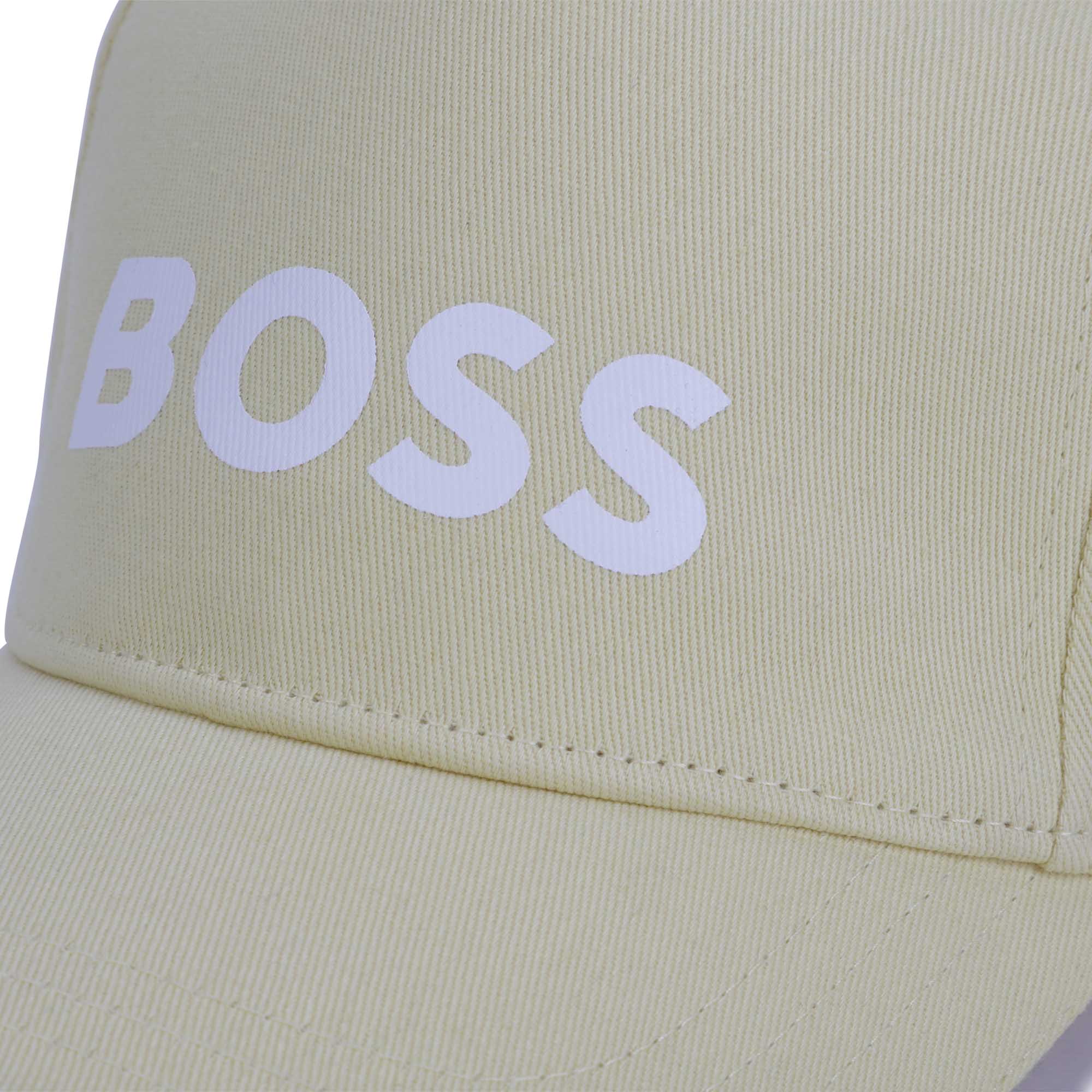Boss boys yellow cap close up