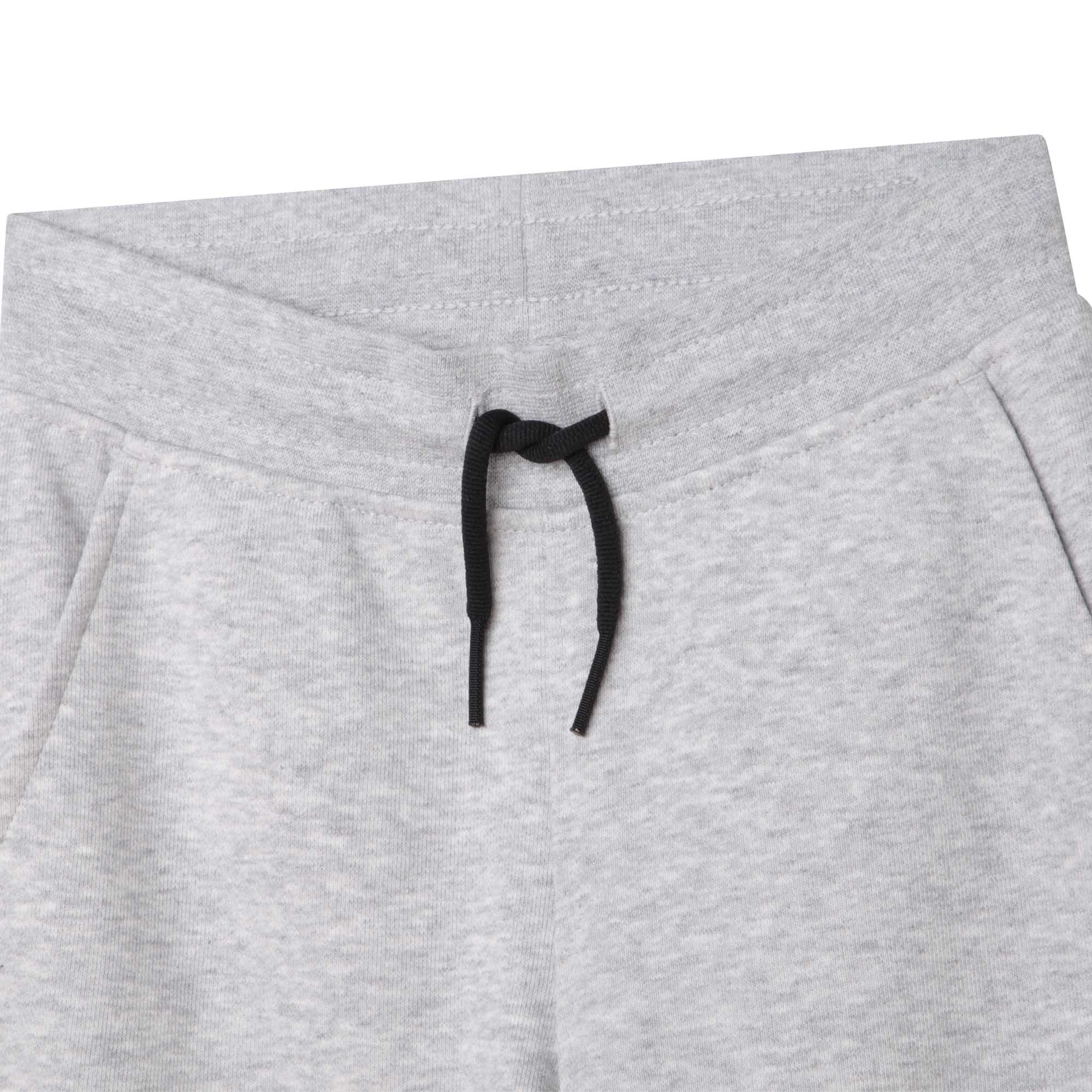 Boss boys grey tracksuit bottoms with large black logo close up