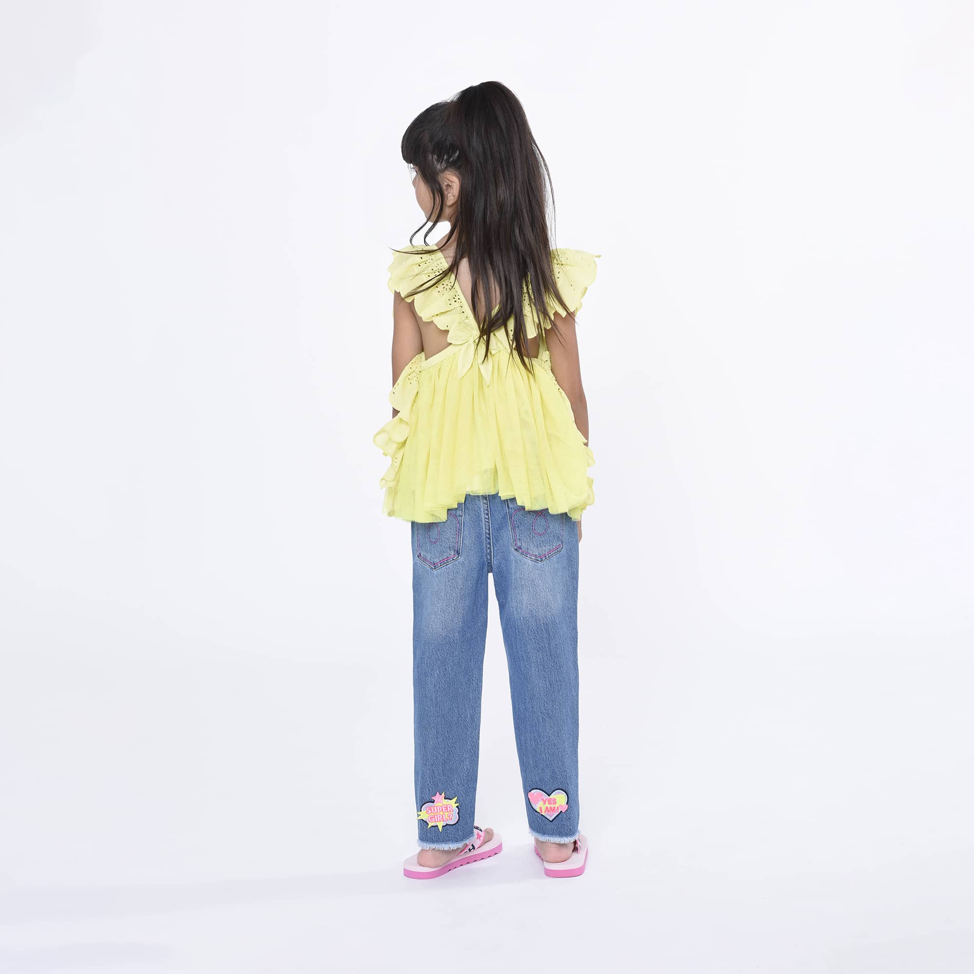 Billieblush girls jeans with heart logos on model