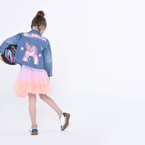 Billieblush model with unicorn denim jacket back view