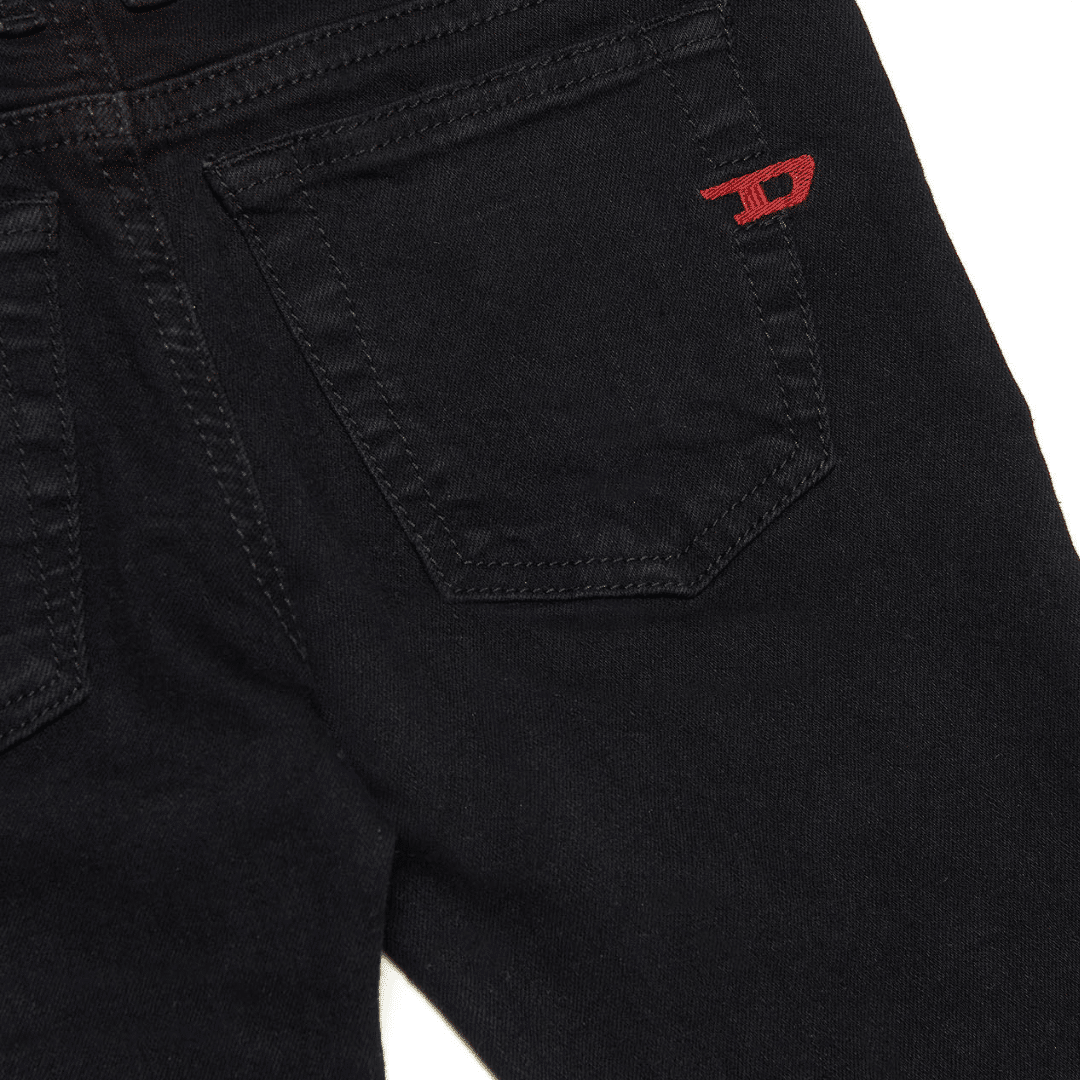 Diesel black boys jeans with red D logo close up