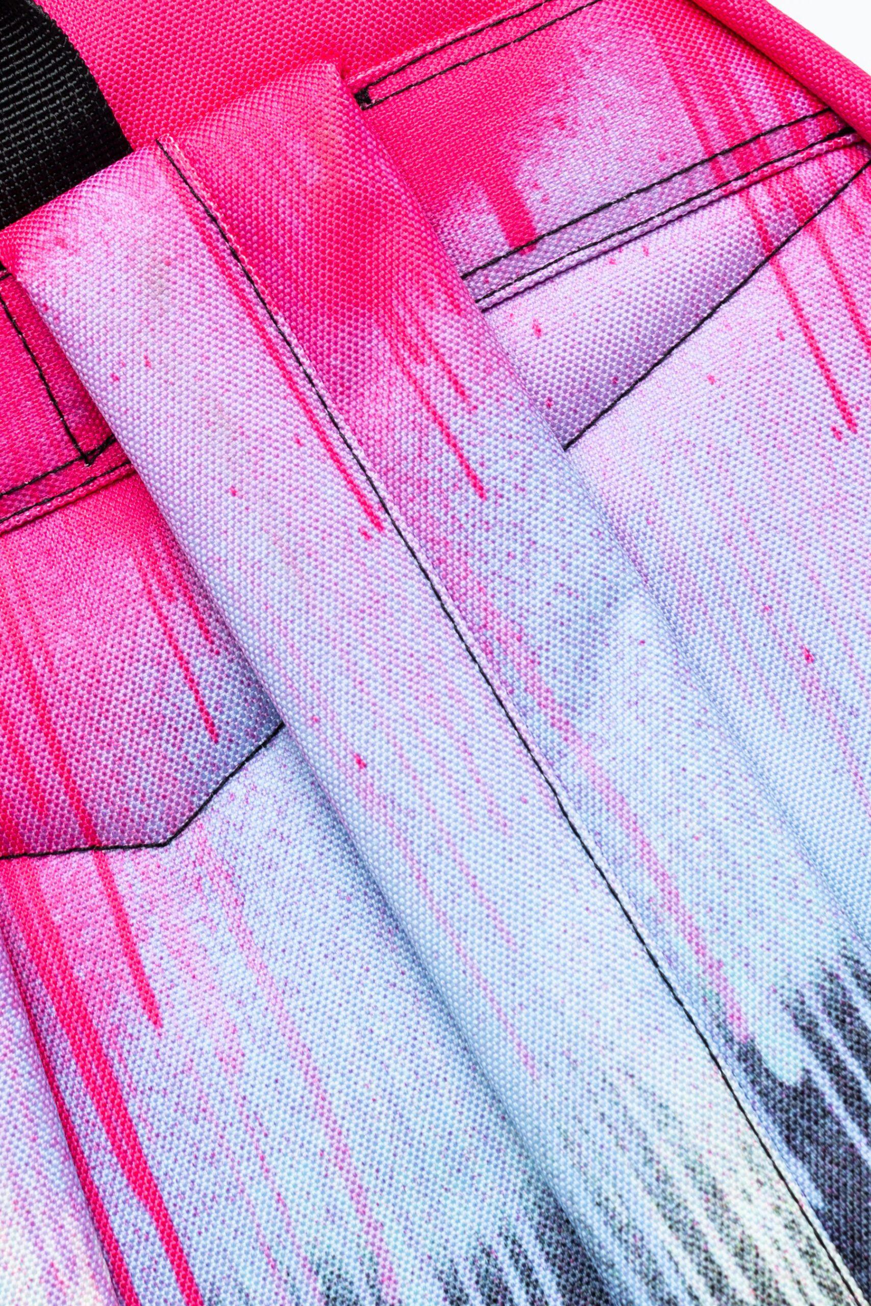 Hype pink and black paint drip backpack strap close up