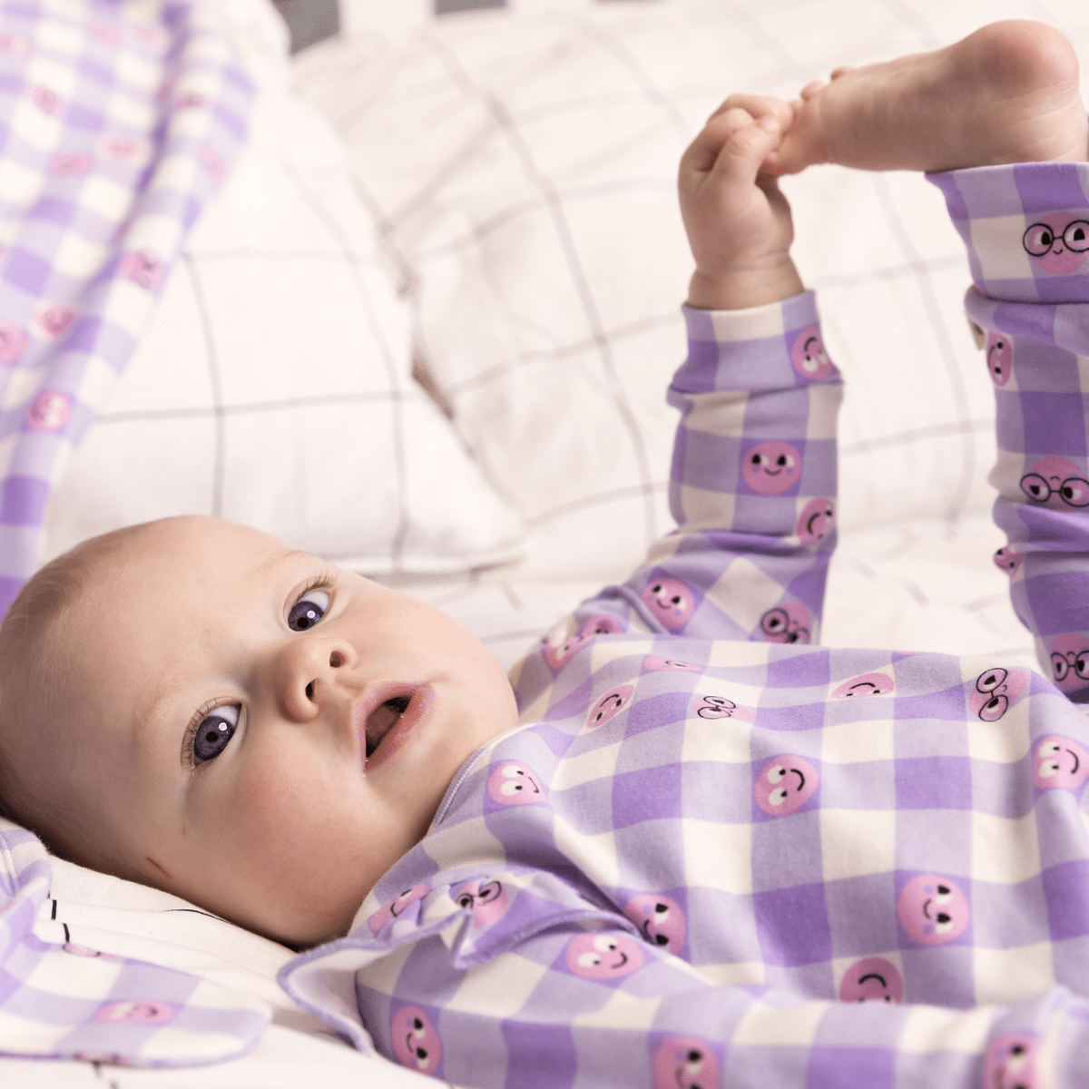 bonnie mob baby lilac tiddlywink sleep suit on model