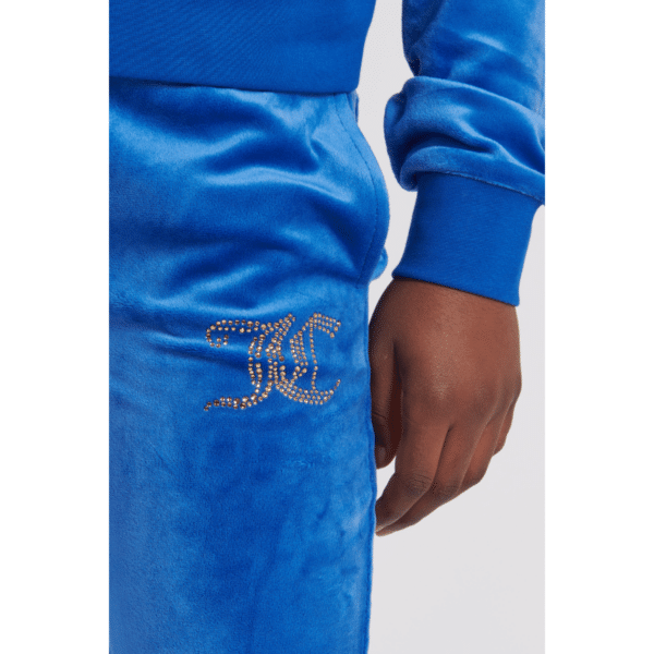 juicy couture girls blue velour trousers close up of logo
