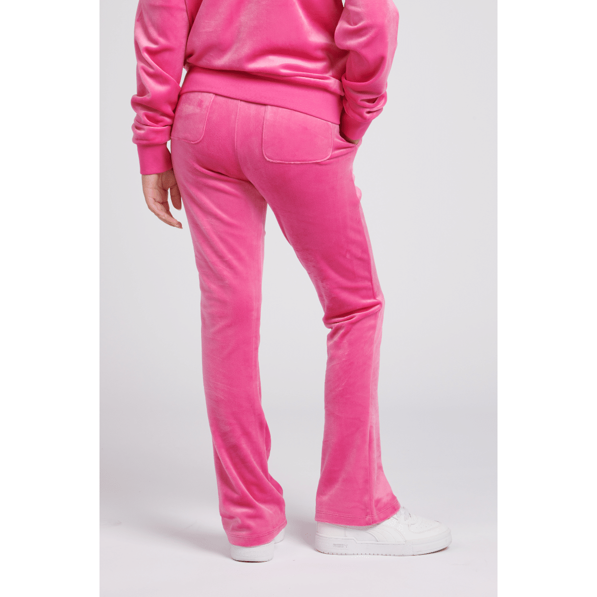 juicy couture girls pink velour bootcut trousers back view on model
