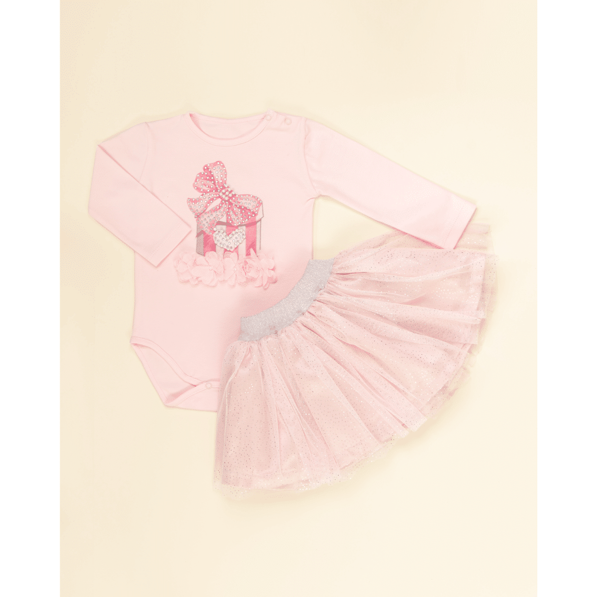 Caramelo pink tulle skirt on baby model flat lay