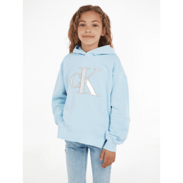 calvin klein girls pale blue hoodie with large silver metallic logo on model
