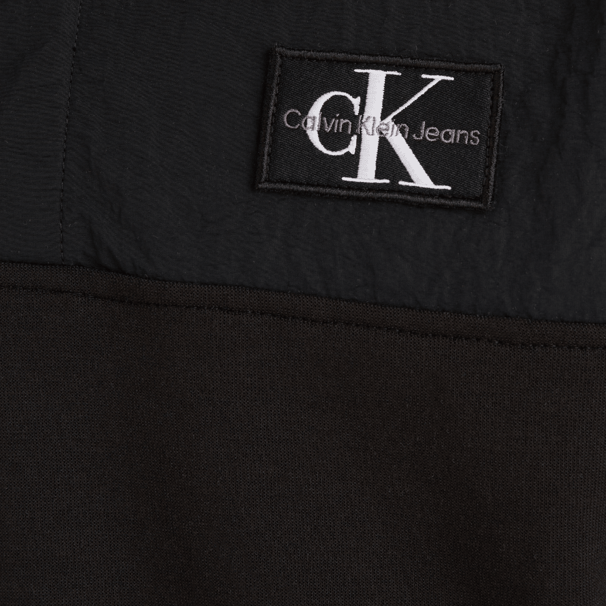 calvin klein unisex childrens black hoodie with white logo close up of logo