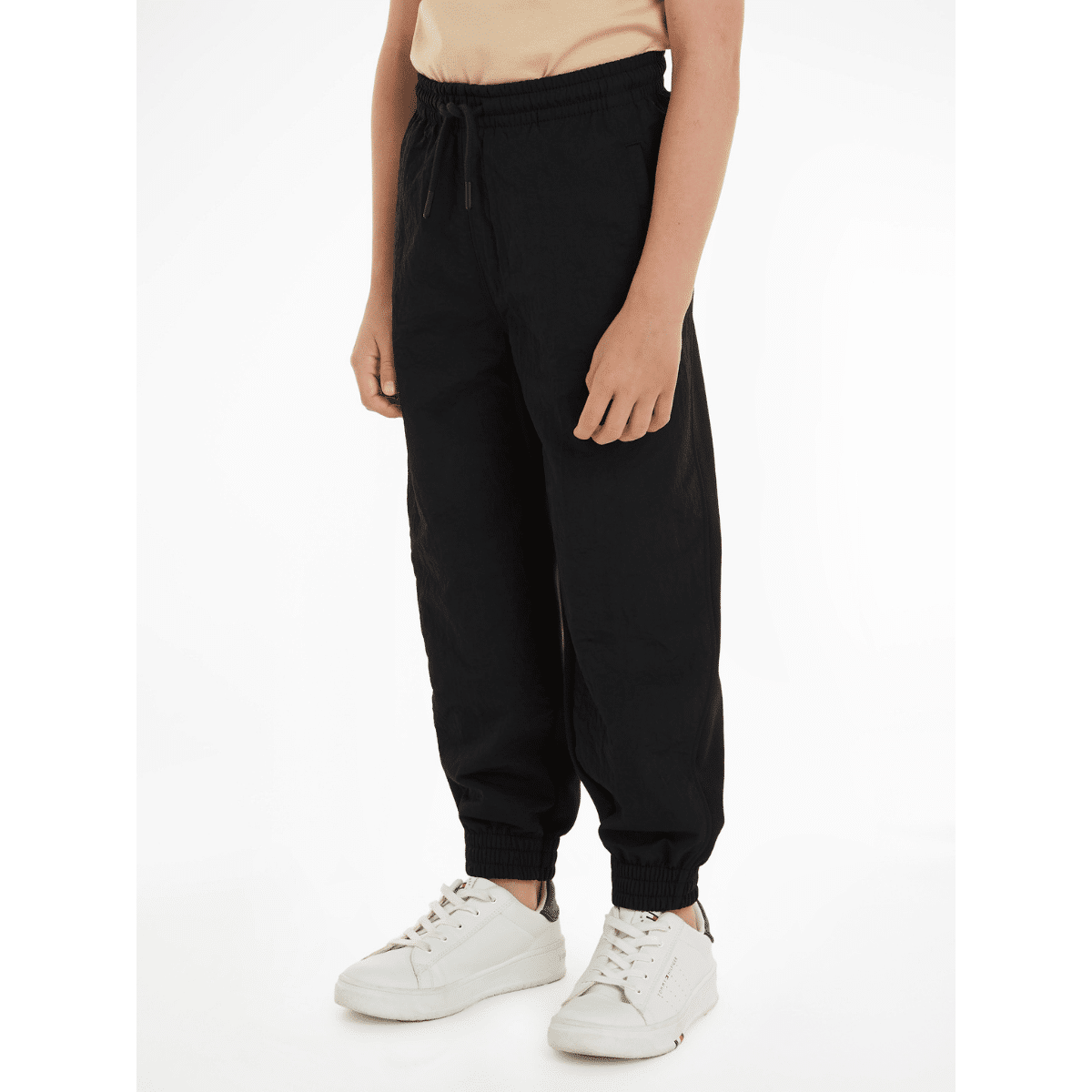 Calvin klein unisex childrens black joggers on model with white trainers